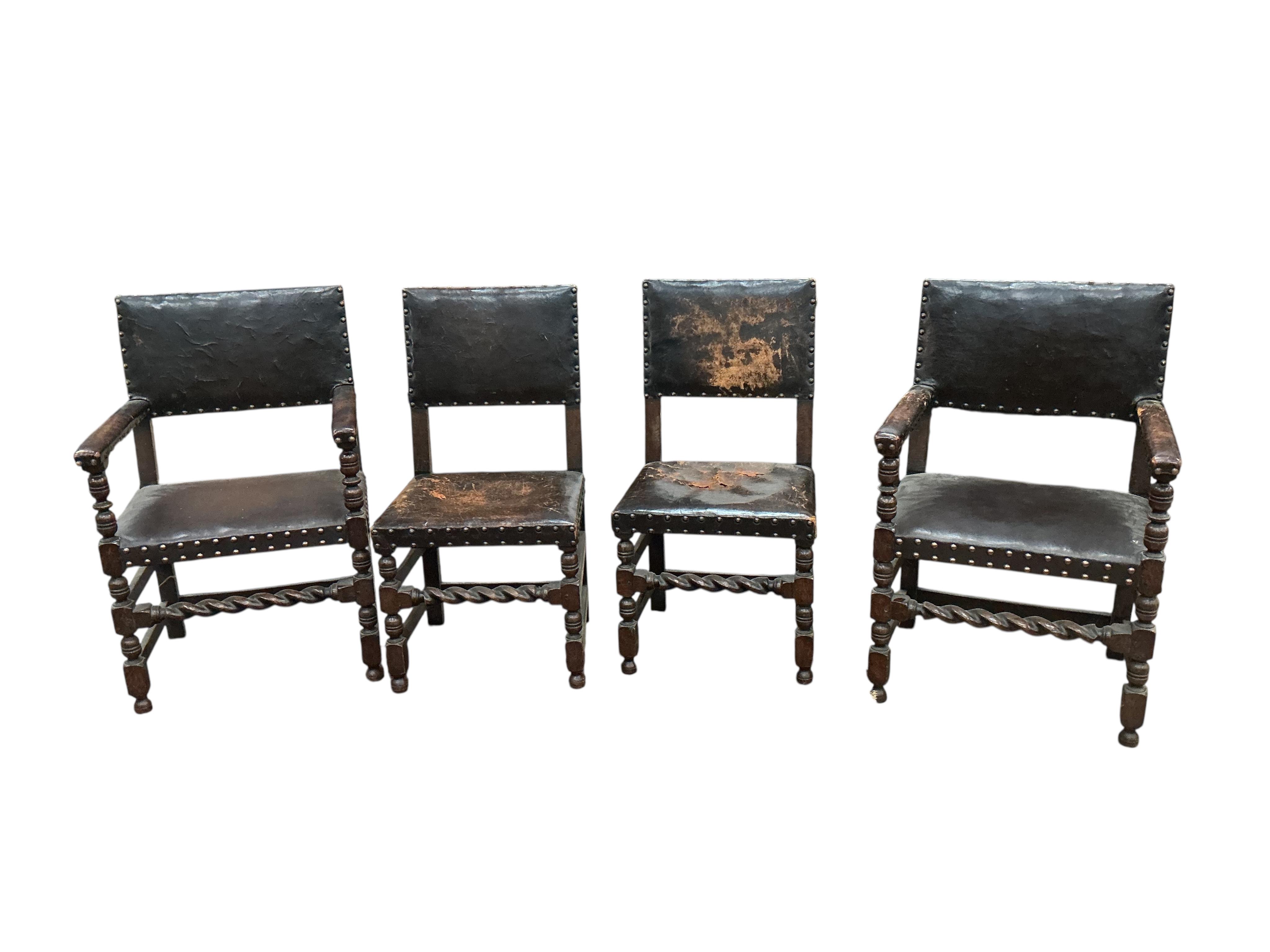 A set of eight Tudor style oak dining chairs, two with arms